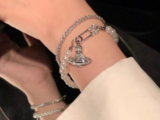 Pulsera de Strass y Perlas con Dije Saturno 2pcs